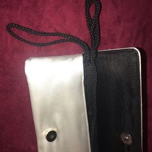 Benjamin Walk silver clutch with shoulder strap